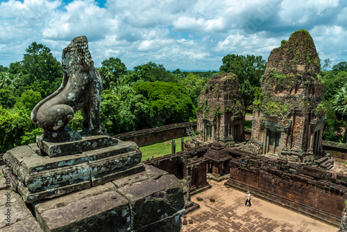 general sight and statue of vigilant lion of the archaeological place of pre rup in siam reap, cambodia
