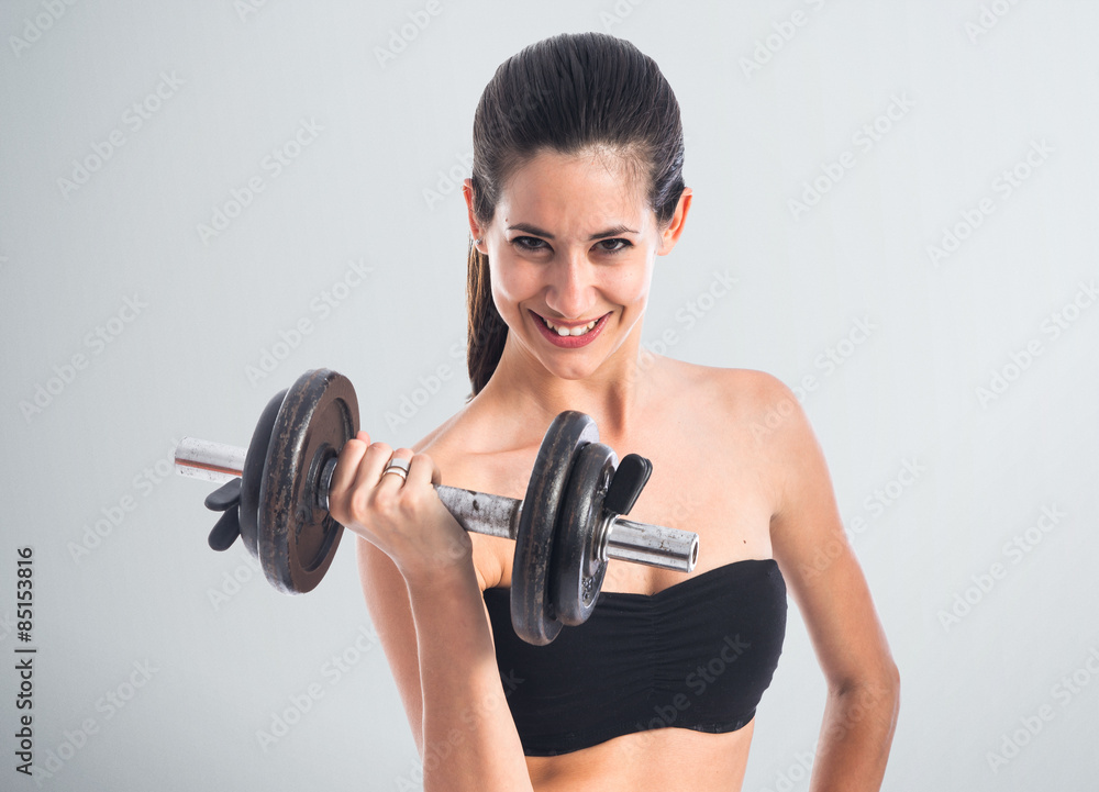 Obraz premium Sport woman doing weightlifting