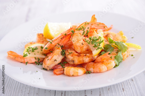 fried shrimp with garlic and parsley photo