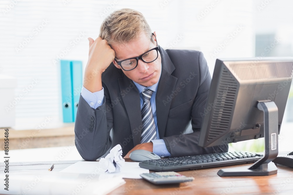 Businessman being depressed by accounting Businessman being depressed by accounting