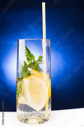 fresh cold cocktail in glass with sliced citus photo