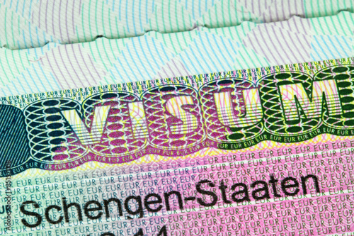 Closeup of the Schengen visa to Austria, Germany with shallow DOF, focusing on the word VISUM  photo