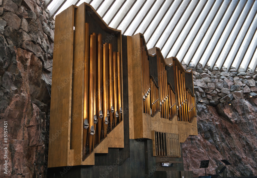 A historic pipe organ in church in rock