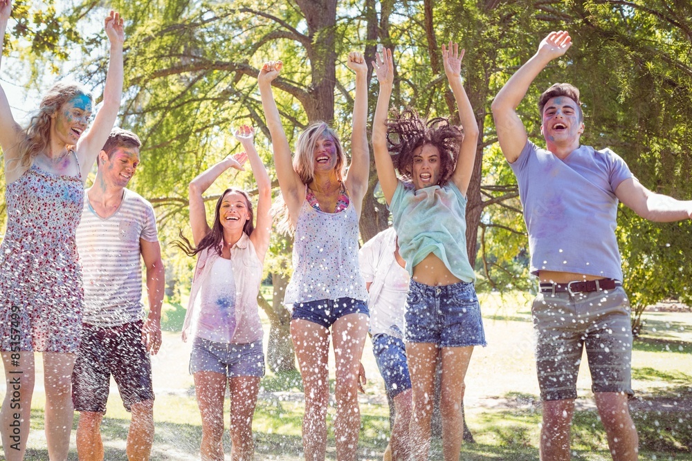 Fototapeta premium Happy friends jumping in the water shoot