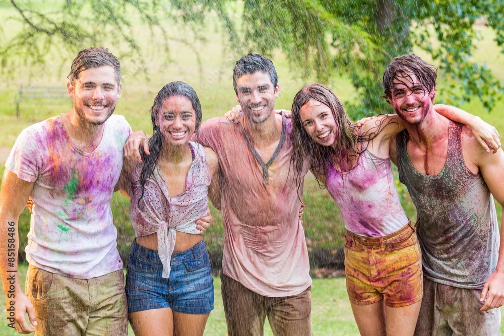Happy friends covered in powder paint Happy friends covered in powder paint