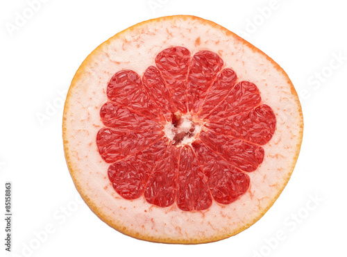 sliced raw red grapefruit on white