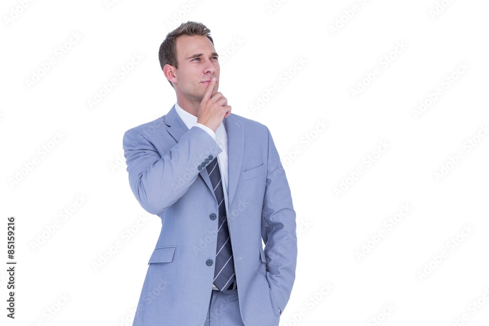 Handsome businessman thinking with finger on chin Handsome businessman thinking with finger on chin