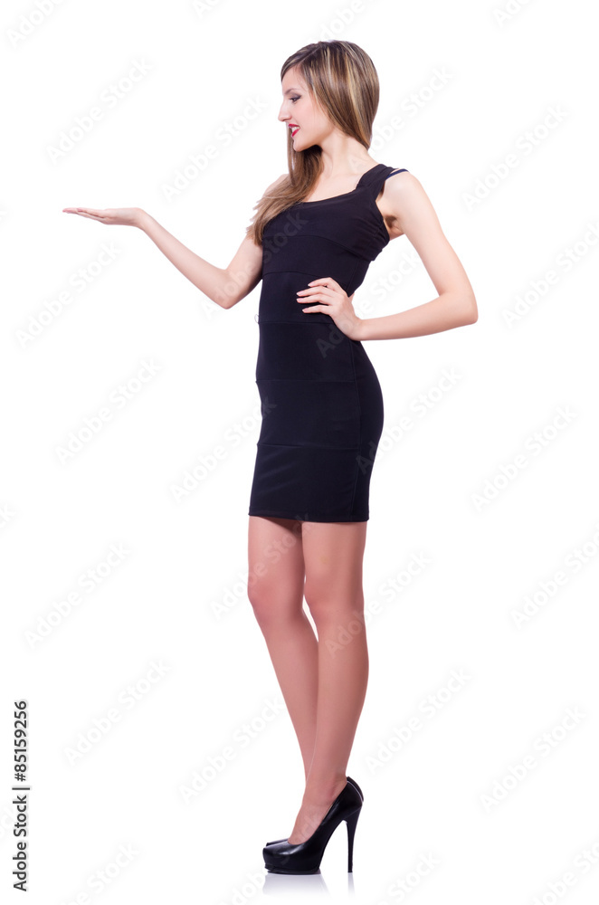 Young blond girl in black dress holding isolated on white Young blond girl in black dress holding isolated on white