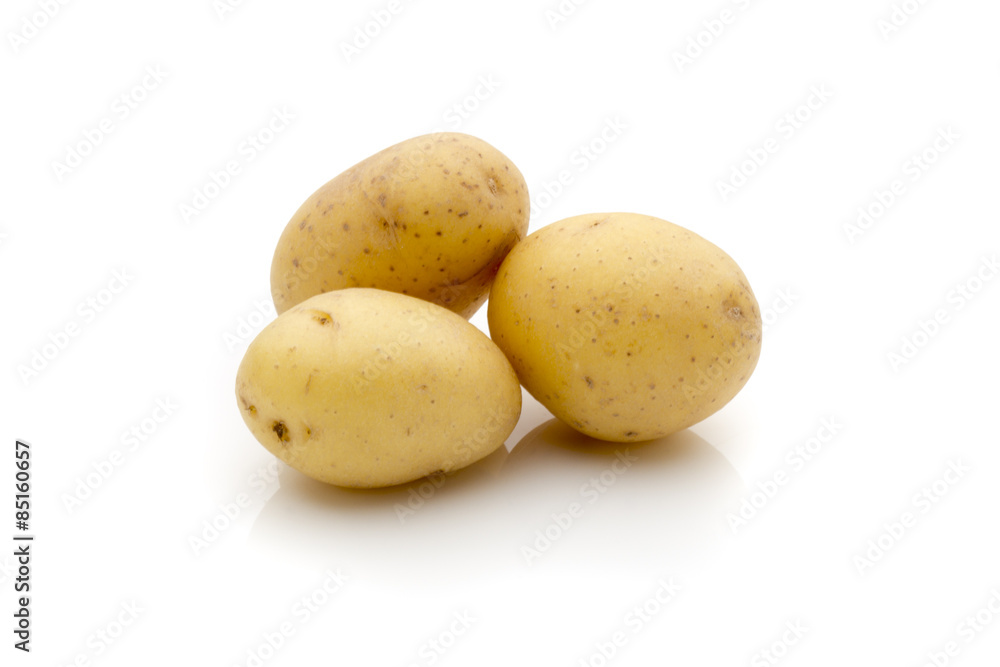 Potatoes on the white background. New harvest. Potatoes on the white background. New harvest.
