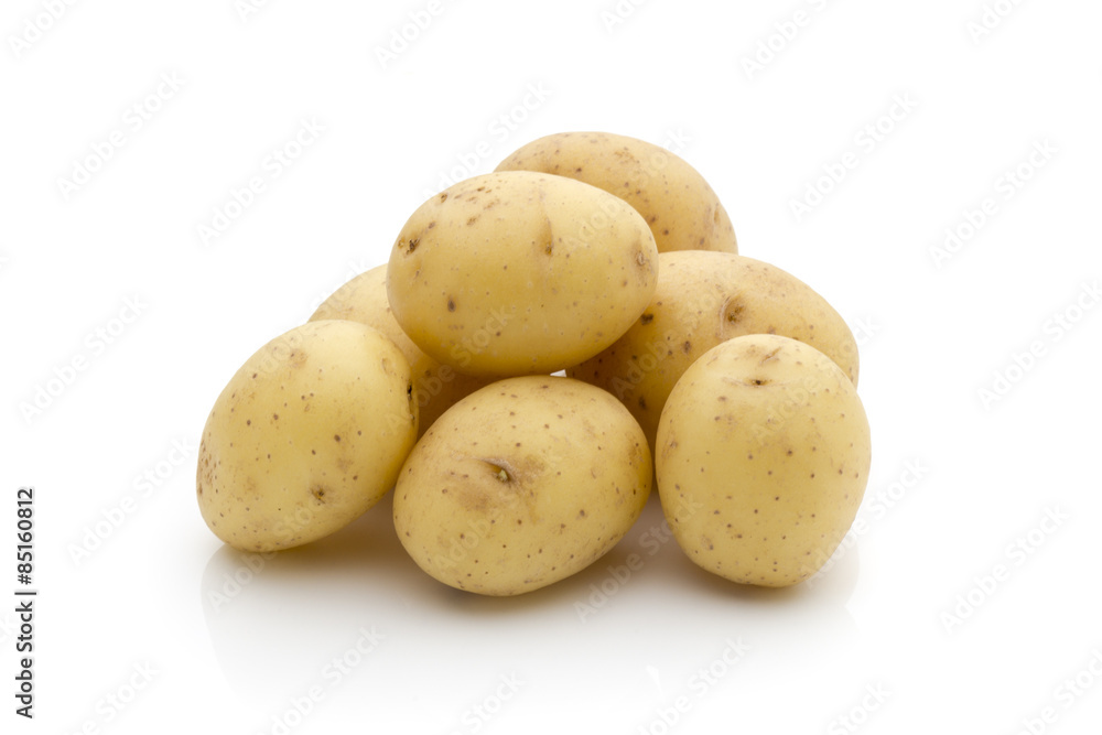 Potatoes on the white background. New harvest. Potatoes on the white background. New harvest.