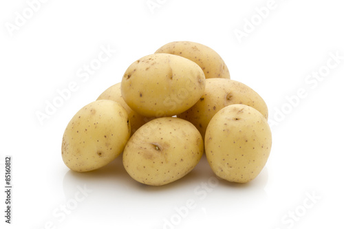 Potatoes on the white background.  New harvest.