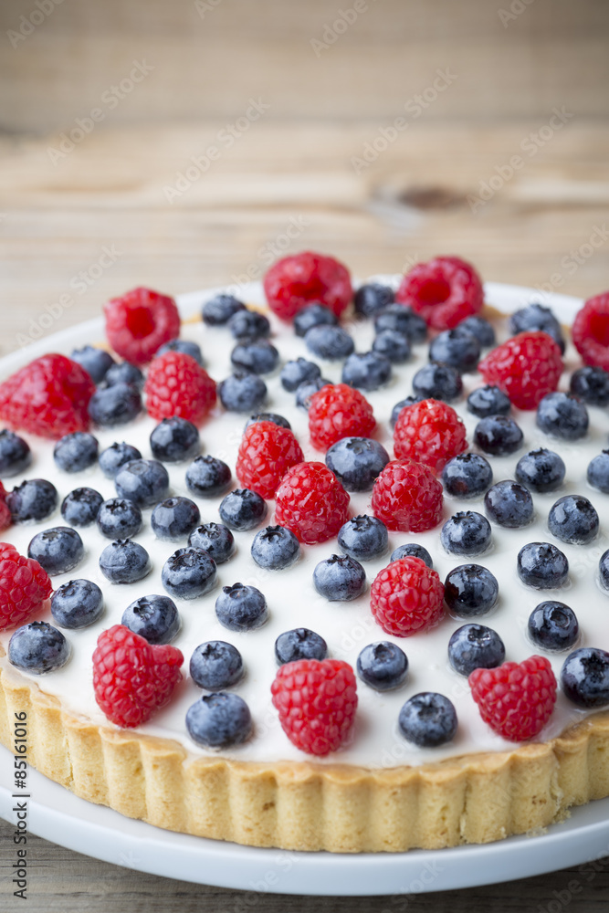 Cake with blueberries and raspberries. Confectionery product. Cake with blueberries and raspberries. Confectionery product.