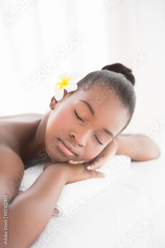 Pretty woman lying on massage table 