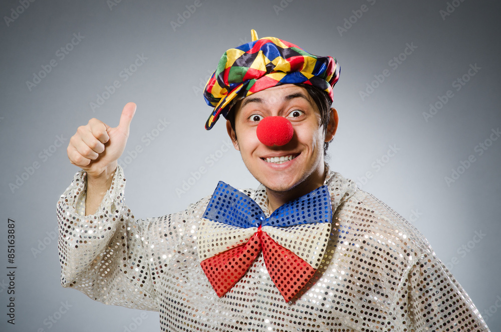 Funny clown against dark background Funny clown against dark background