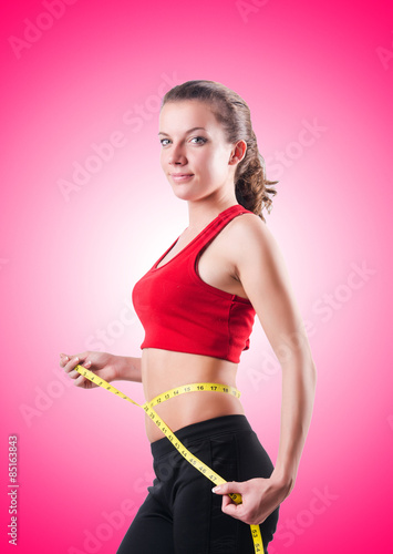 Young girl with centimeter in dieting concept © Elnur