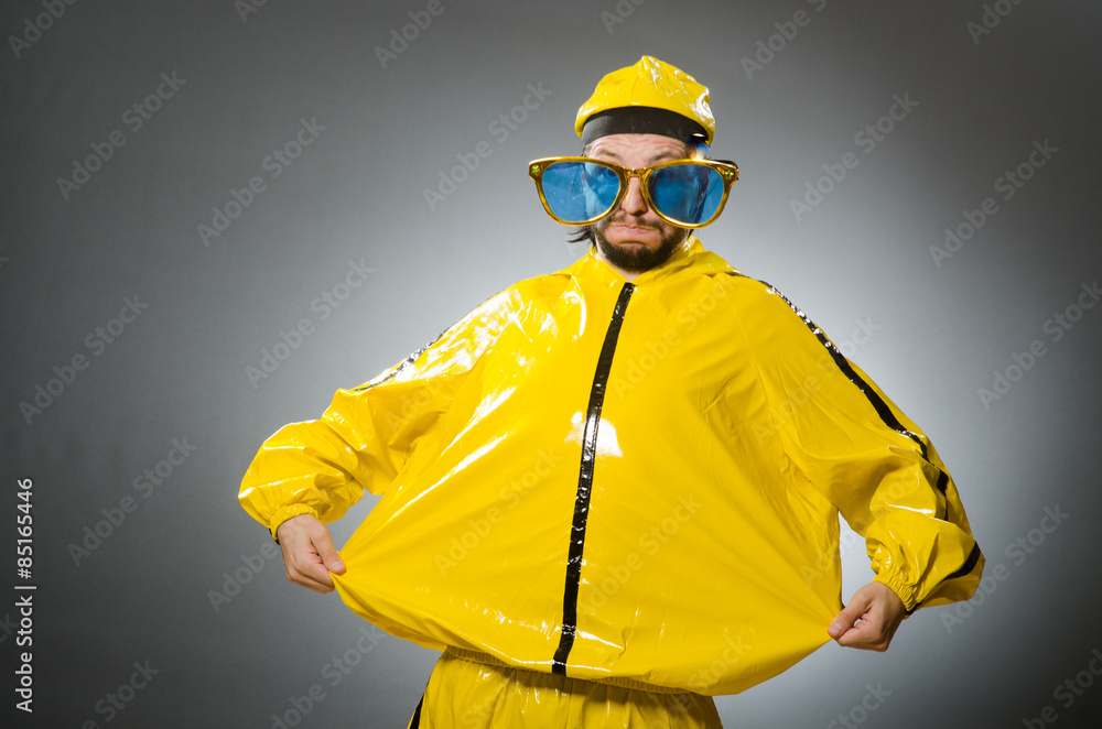 Man wearing yellow suit in funny concept