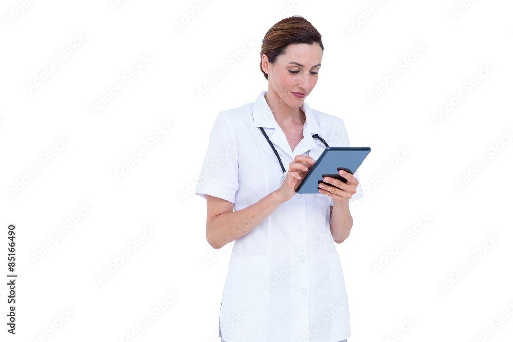 Confident doctor using tablet Confident doctor using tablet