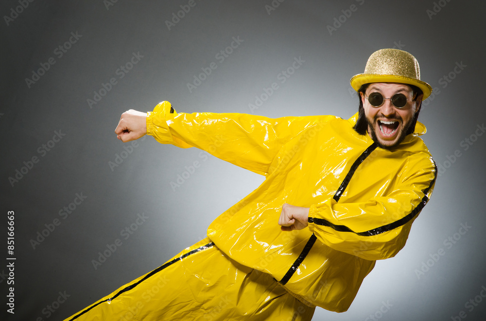 Man wearing yellow suit in funny concept Man wearing yellow suit in funny concept