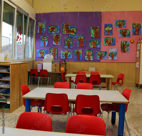 classroom of a kindergarten with red chairs