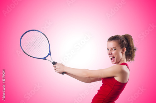 Woman playing tennis against the gradient © Elnur