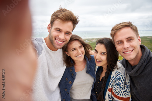 Friends posing for selfie outdoors in nature