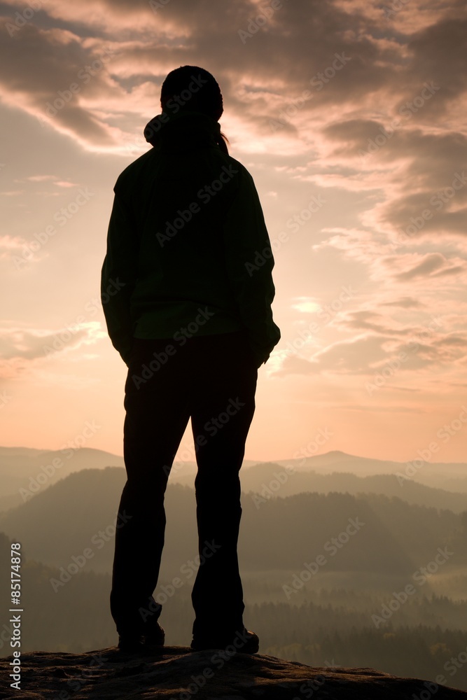 Girl stand on the sharp corner of sandstone rock in rock empires park Girl stand on the sharp corner of sandstone rock in rock empires park