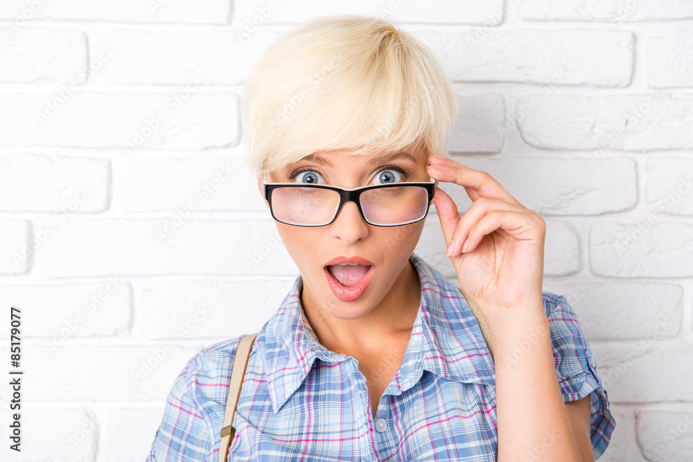 surprised girl adjusts his glasses surprised girl adjusts his glasses
