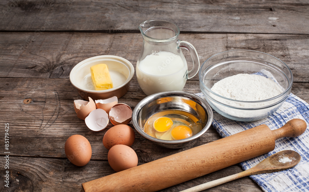 rough background with the ingredients for a cake rough background with the ingredients for a cake