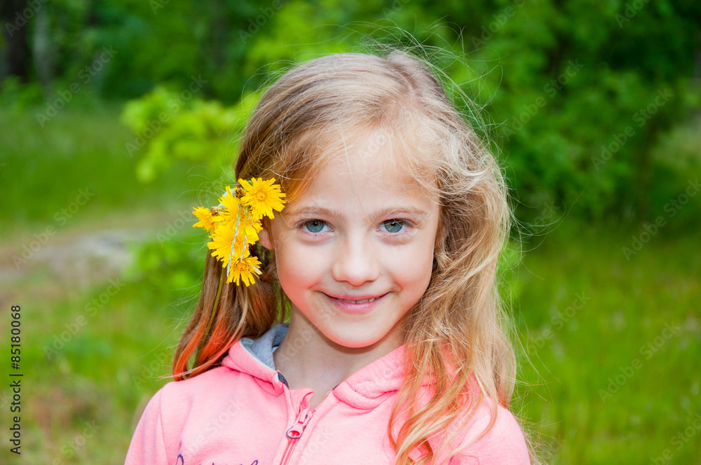 Cute little girl on the meadow with flower Cute little girl on the meadow with flower