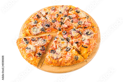 Tasty pizza on a wooden board 