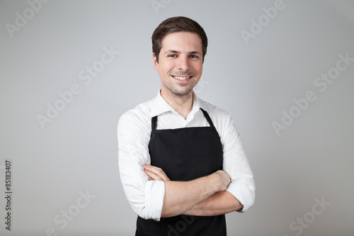 shop assistant with apron (supermarket; coffee bar)