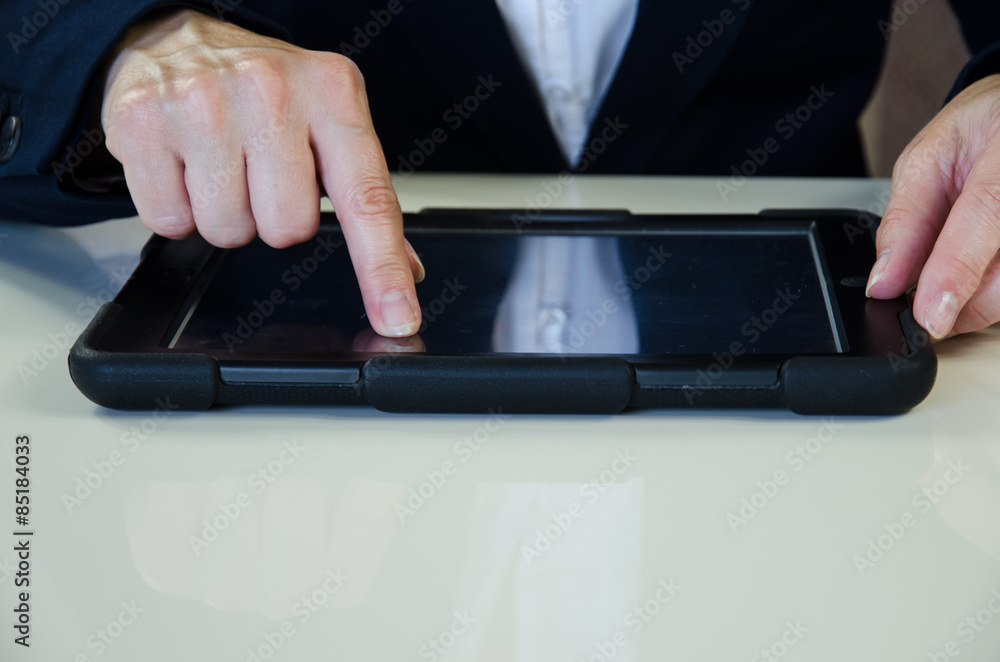 hand and tablet..typing message into mobile hand and tablet..typing message into mobile