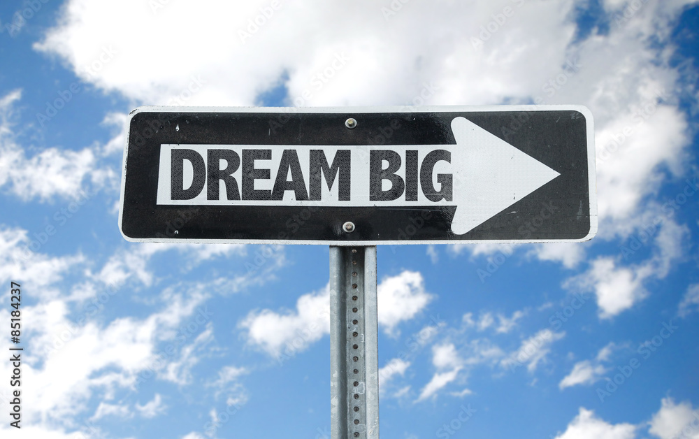 Dream Big direction sign with sky background Dream Big direction sign with sky background