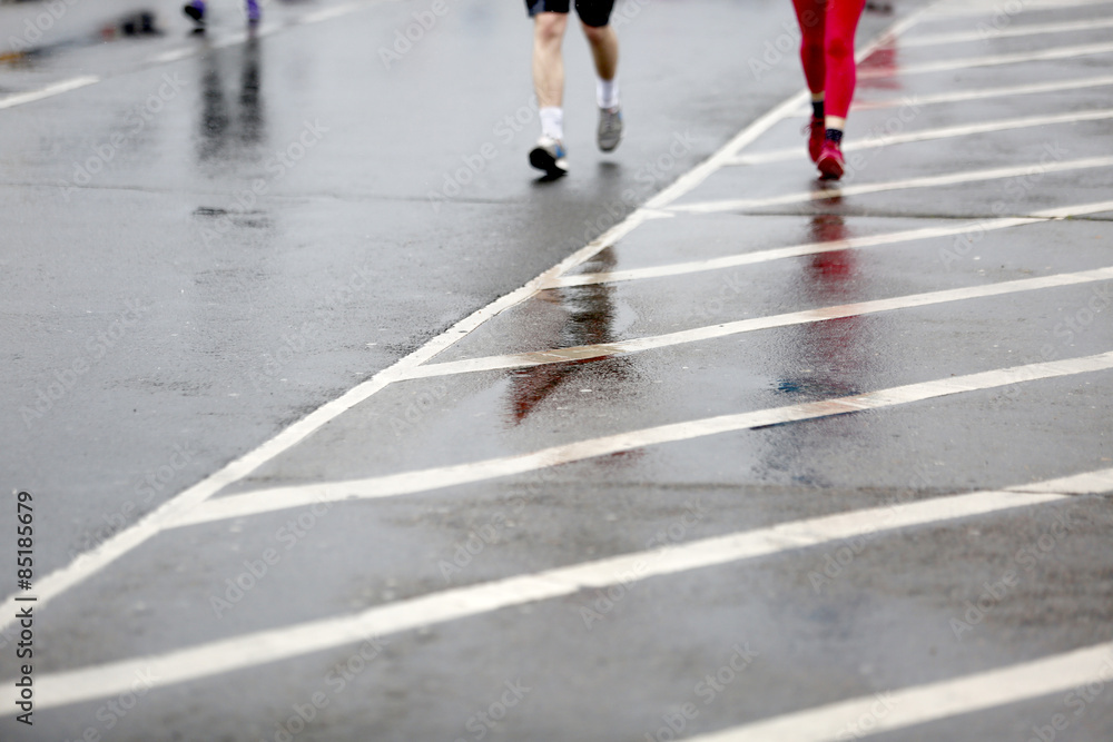 Running in the rain blurred motion few people