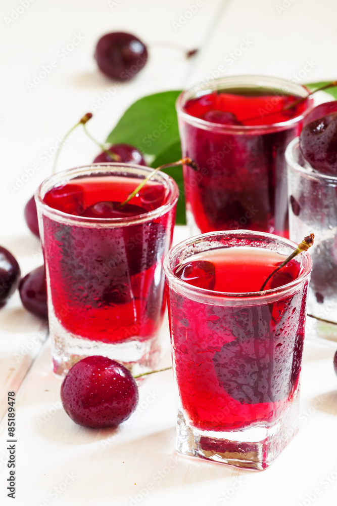 Fresh cherry juice with berries, selective focus Fresh cherry juice with berries, selective focus