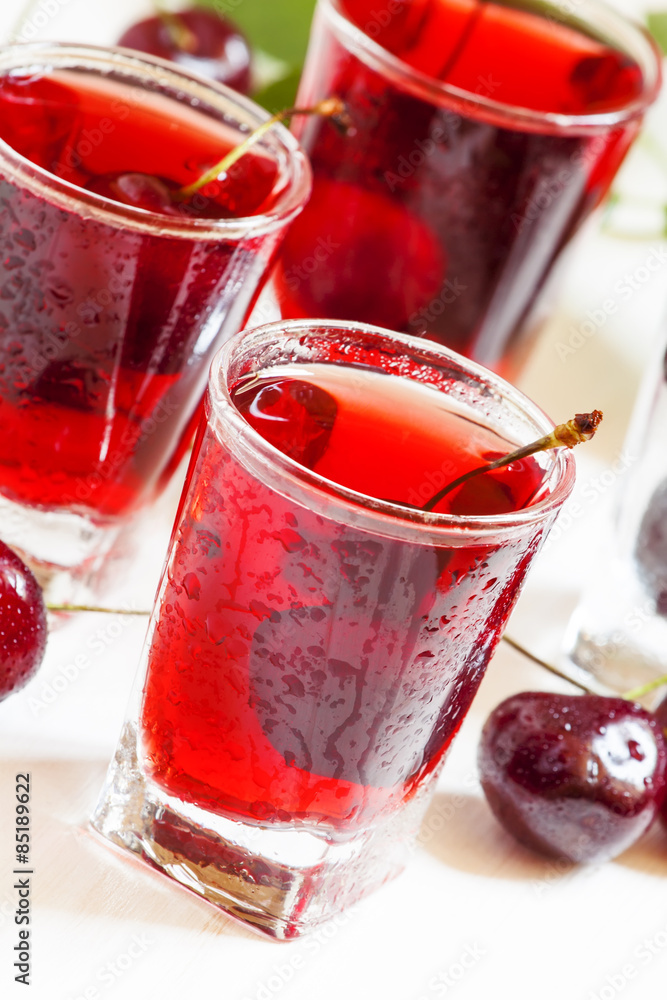 Fresh cherry juice with berries, selective focus Fresh cherry juice with berries, selective focus