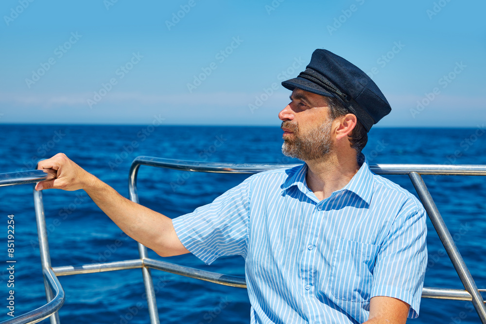 Beard sailor cap man sailing sea ocean in a boat