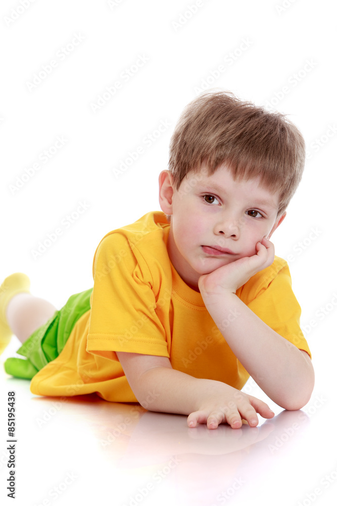 Adorable little blond boy lying Adorable little blond boy lying