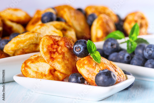 Mini pancakes with fresh blueberries