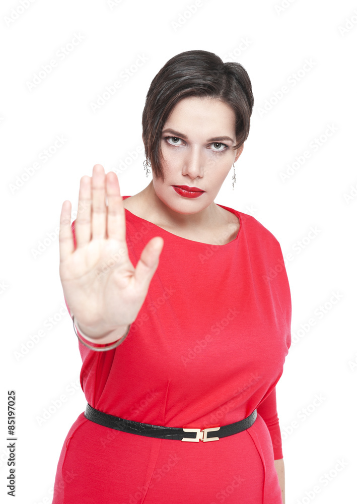 Beautiful plus size woman in red dress making stop sign gesture Beautiful plus size woman in red dress making stop sign gesture