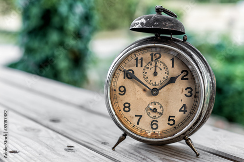 Landscape with old alarm clock