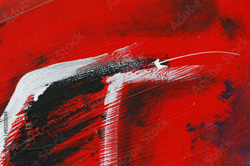 Small part of painted metal wall with  black,red and white paint