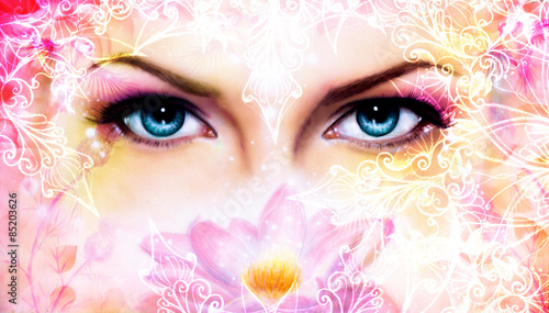  blue women eyes beaming up enchanting from behind a blooming 