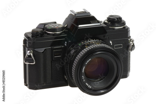Classic 135 format SLR camera on a white background - isolated