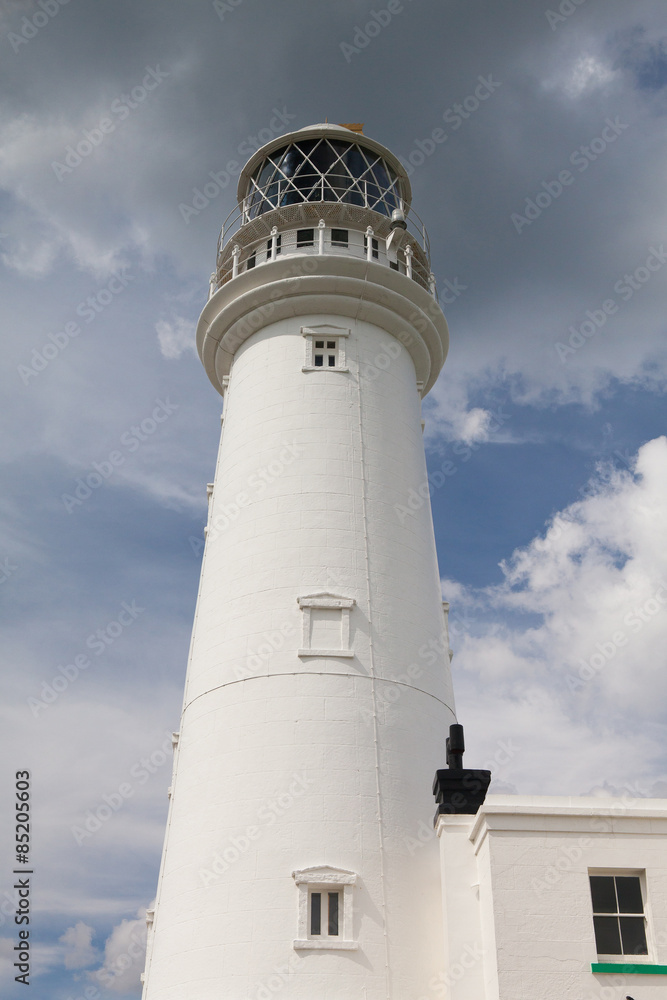 White lighthouse on Flamborough Head in England. White lighthouse on Flamborough Head in England.