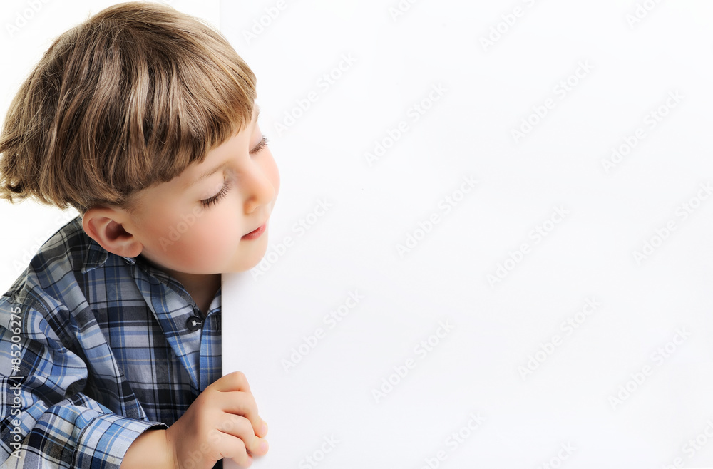 Portrait of a boy holding blank billboard or large white sheet o Portrait of a boy holding blank billboard or large white sheet o