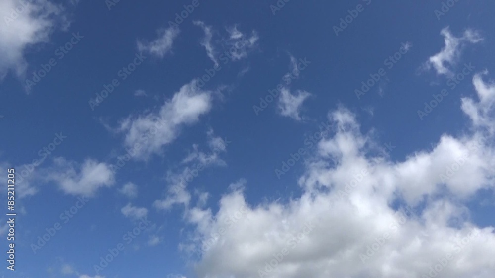 Time lapse of white fluffy clouds on a Blue Sky Time lapse of white fluffy clouds on a Blue Sky