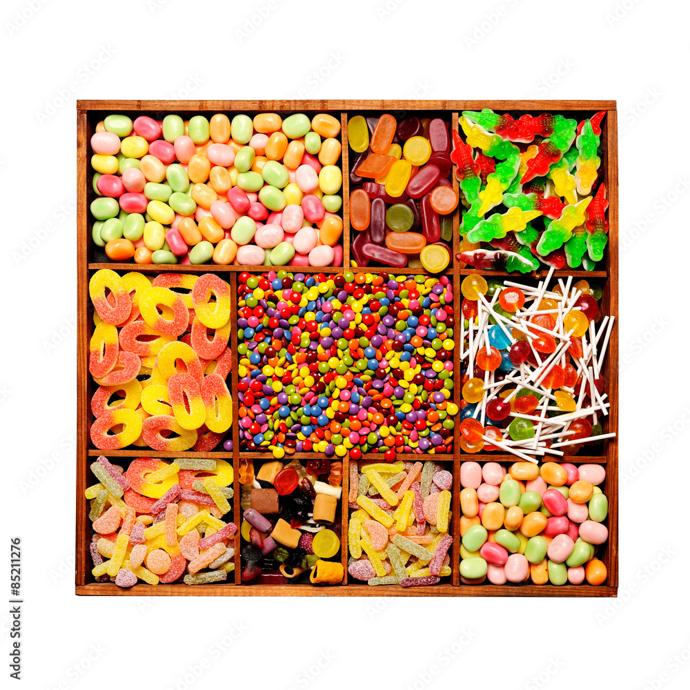Assorted candy sweets in a wooden box Assorted candy sweets in a wooden box