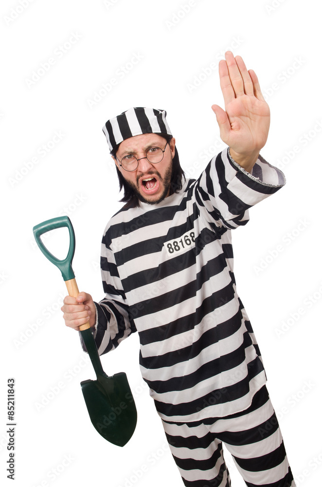 Prison inmate with spade isolated on white Prison inmate with spade isolated on white