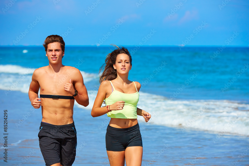 Couple young running in the beach in summer Couple young running in the beach in summer